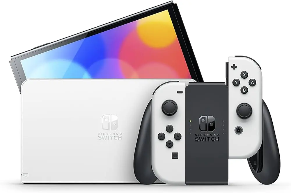 Nintendo Switch OLED console with white dock and Joy-Con controllers.