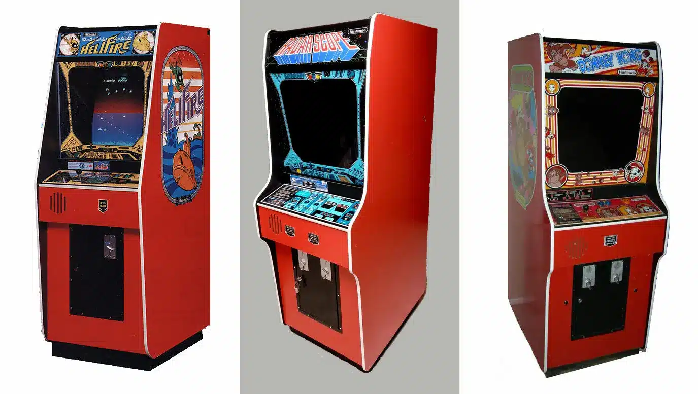 Three arcade cabinets including one with Donkey Kong artwork from 1981.