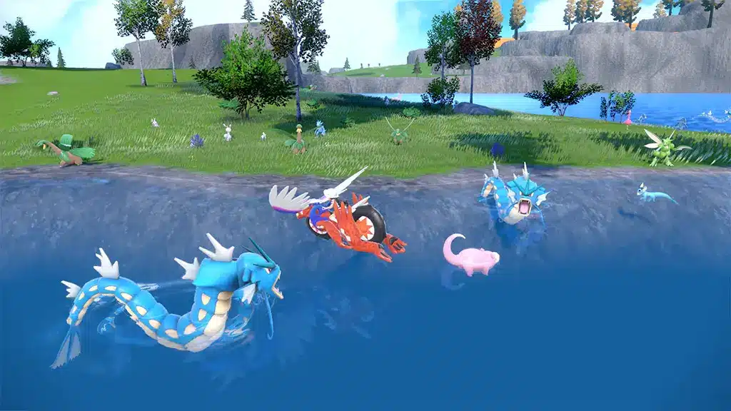 Gameplay screenshot showing Gyarados and other Pokémon in water from Pokémon Scarlet and Violet.