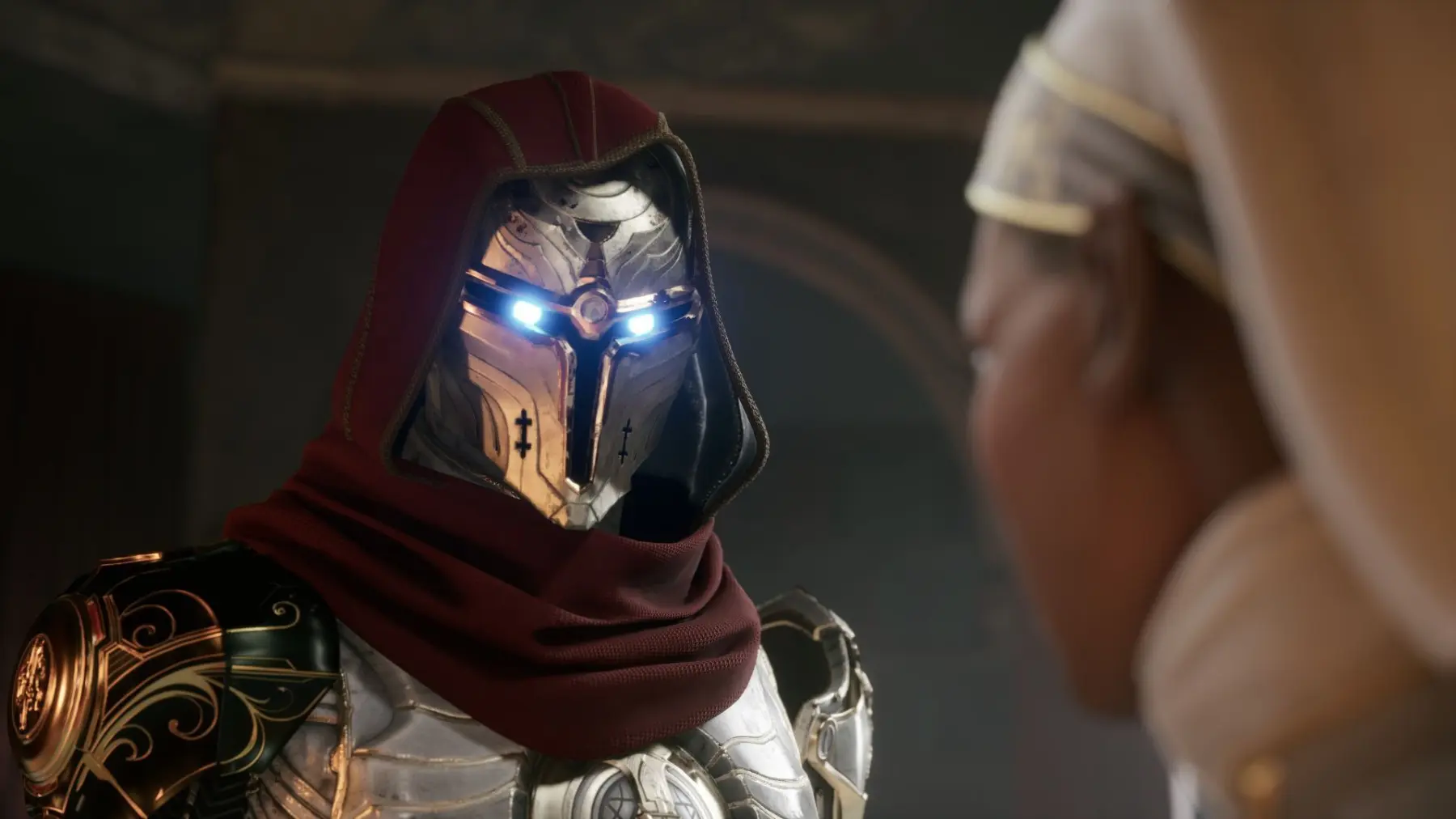 A cinematic shot of a character in ornate silver armor with glowing blue eyes and a red hooded cloak.