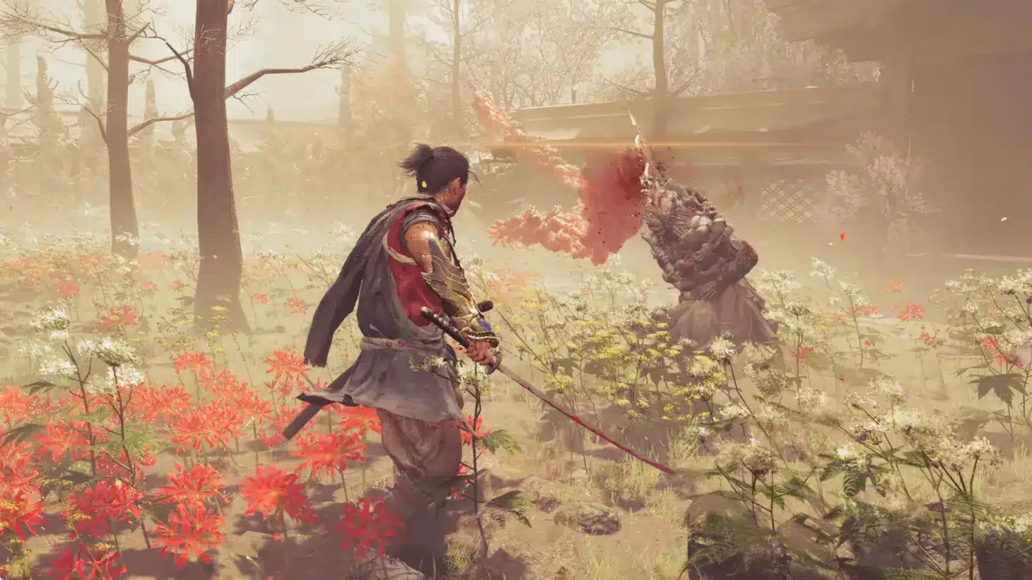 Samanosuke Akechi fighting a demon with a katana in a field of red and white flowers