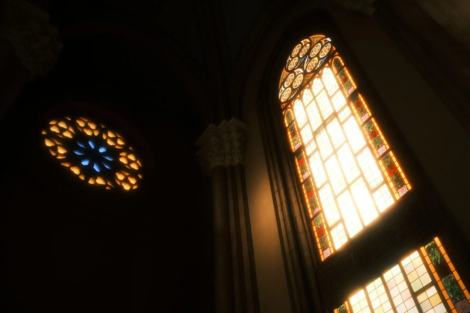 Low angle shot of illuminated stained glass windows in a dark gothic cathedral