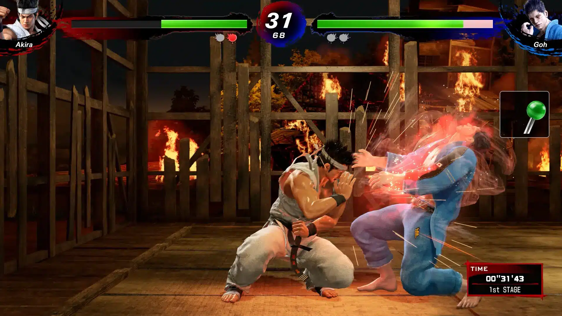 Gameplay screenshot of Akira fighting Goh in Virtua Fighter 5 REVO, featuring a strike impact effect.