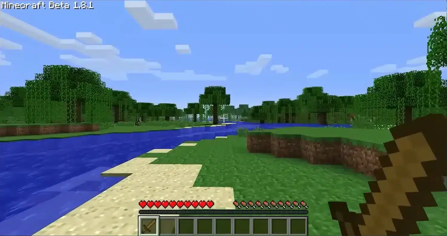 Ein Screenshot aus Minecraft Beta 1.8.1, der eine blockige Landschaft mit einem Fluss und Wäldern zeigt.